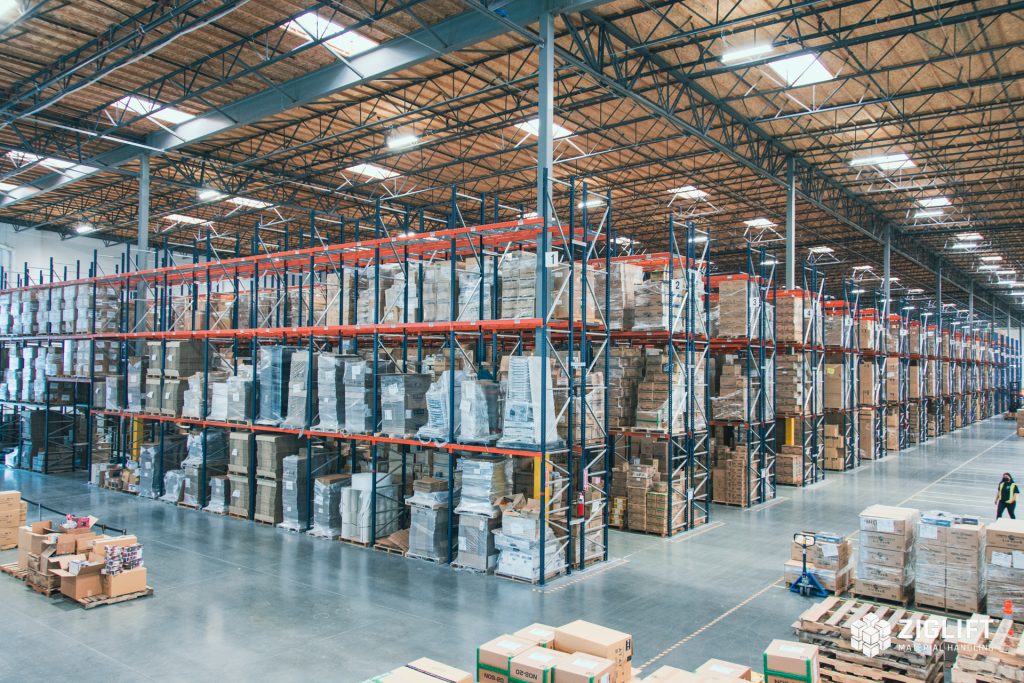 Rows of industrial pallet racks loaded with pallets