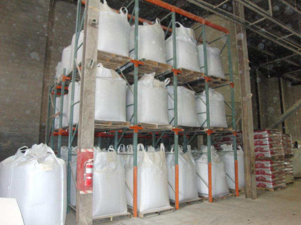 Drive-in warehouse racking loaded with bulk pallets